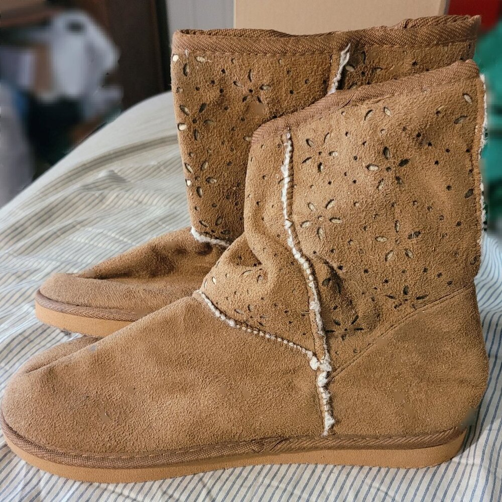 Light tan cozy boots with flower cut outs